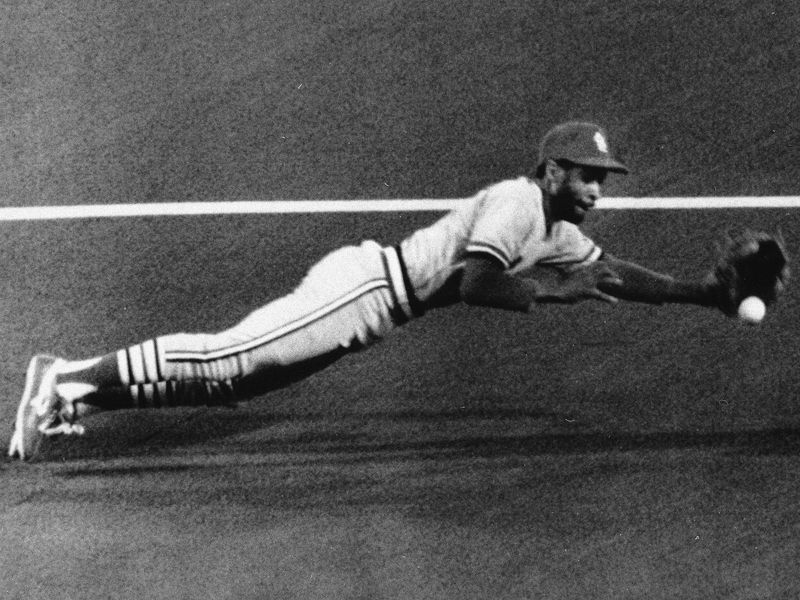 St. Louis Cardinals shortstop Ozzie Smith dives for ball
