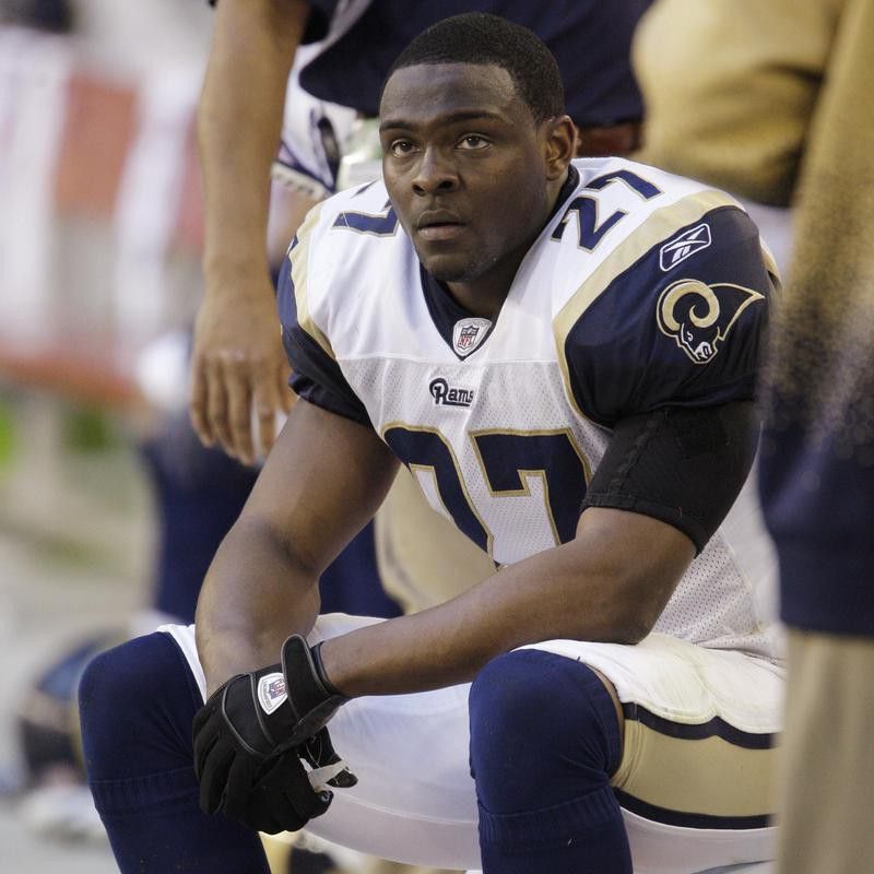 St. Louis Rams' David Roach watches game from bench