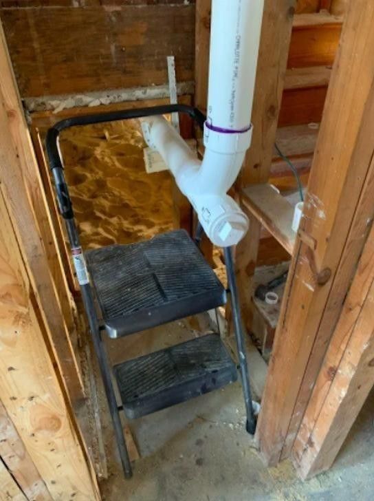 Stool attached to plumbing