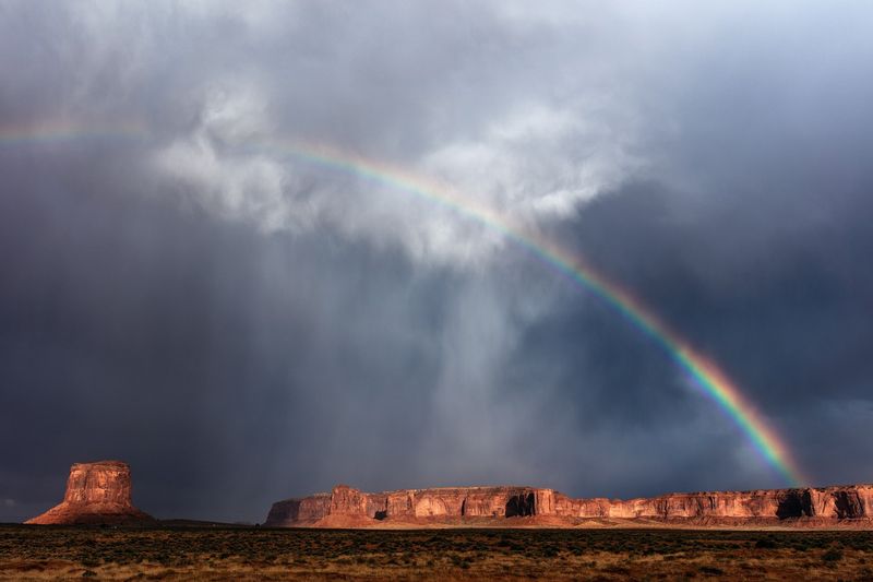 Storm and rainbow over Monument Valley