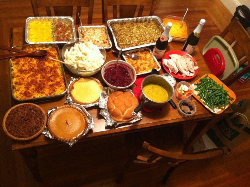 Table full of Thanksgiving side dishes