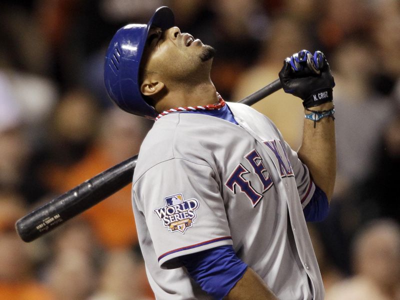Texas Rangers hitter Nelson Cruz reacts to pop fly