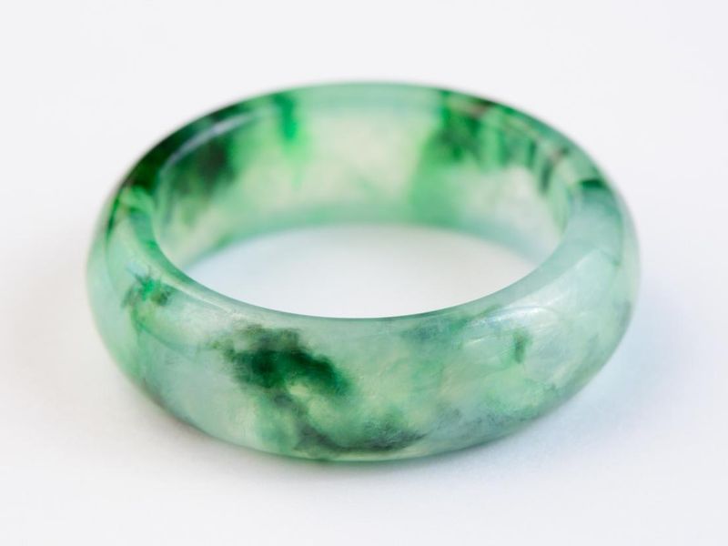 Texture of jadeite ring on white background