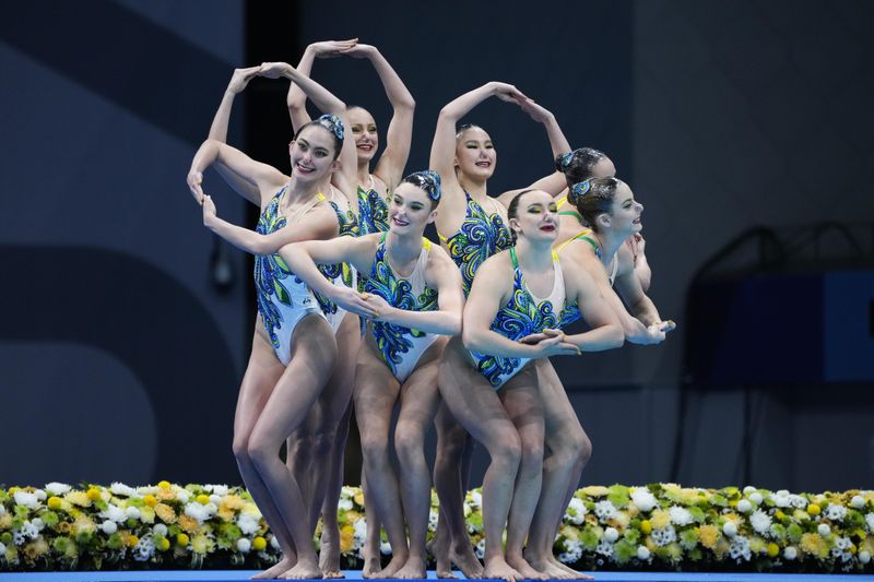 The Australia artistic swimming team competes during technical routine at 2020 Summer Olympics
