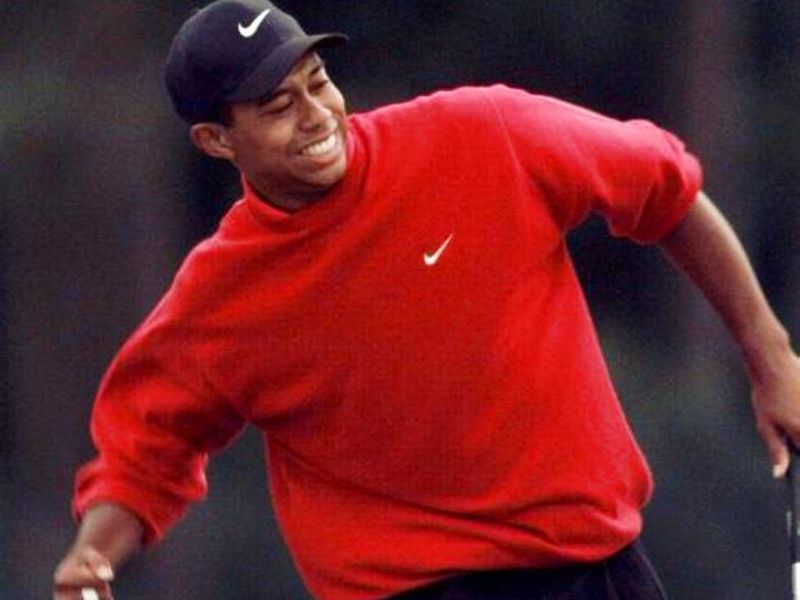 Tiger Woods celebrating after making shot