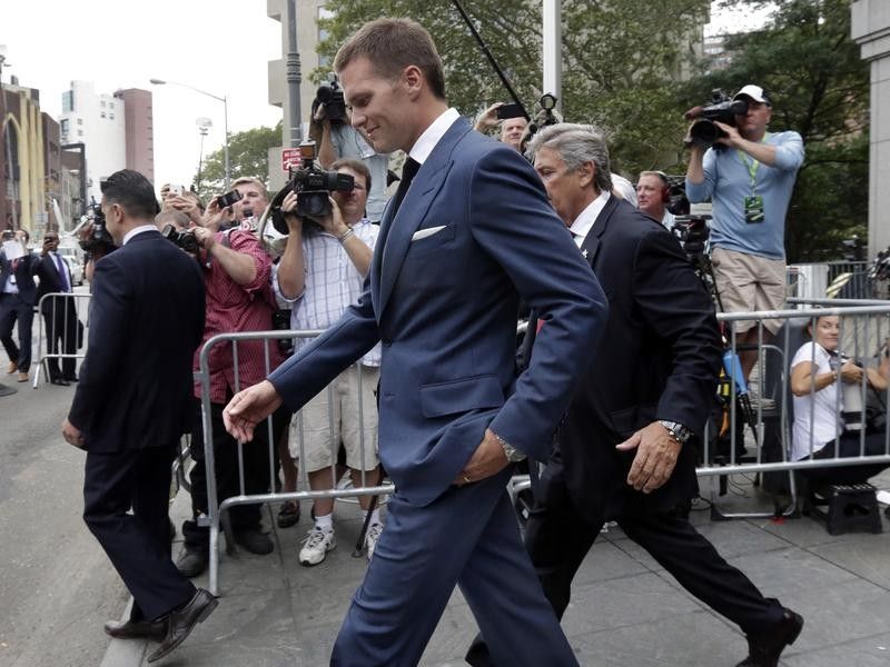 Tom Brady walks out of court