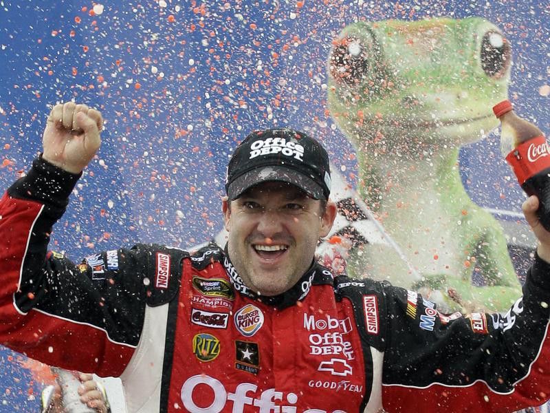 Tony Stewart celebrating after the NASCAR Sprint Cup Series Geico 400 in 2011