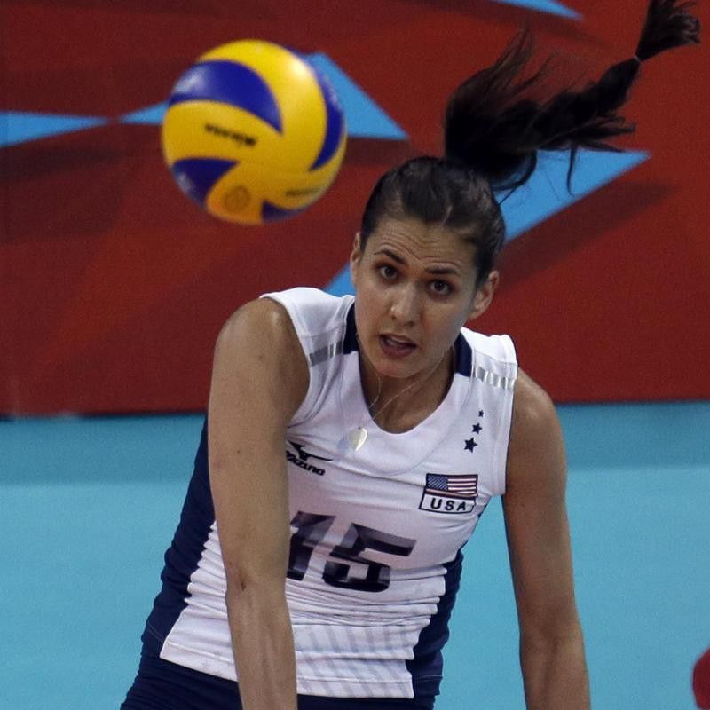 United States' Logan Tom serves during women's preliminary volleyball match