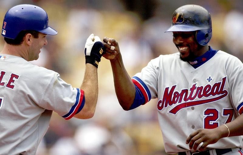 Vladimir Guerrero celebrates with teammate after hitting home run for Montreal Expos