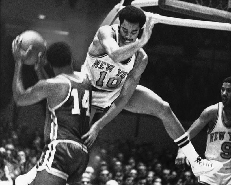 Walt Frazier jumps into the air