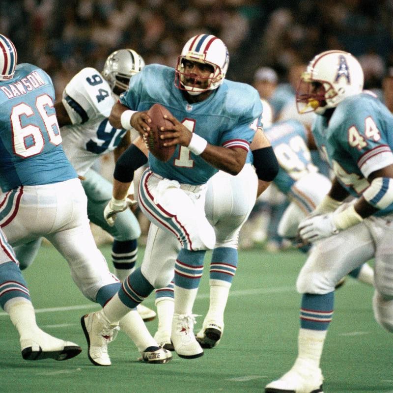Warren Moon of Houston draws back and looks for receiver