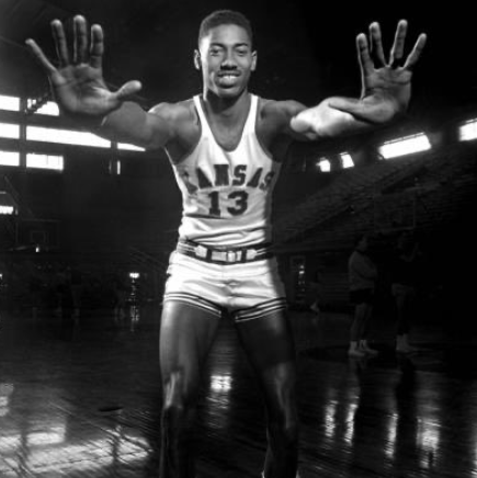 Wilt Chamberlain with arms extended