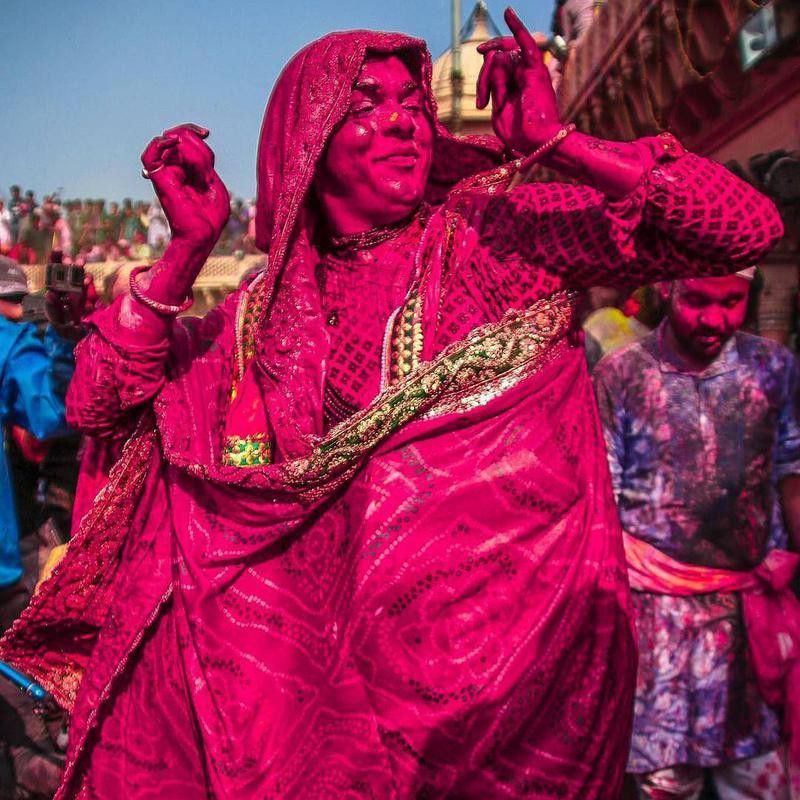 Woman dancing during Holi