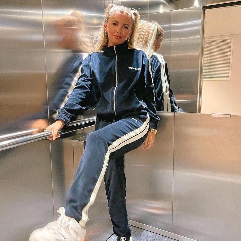 Woman posing in a track suit