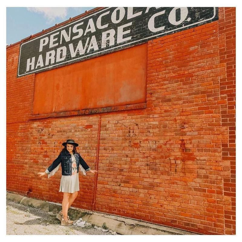 Woman posing outside Pensacola Hardware