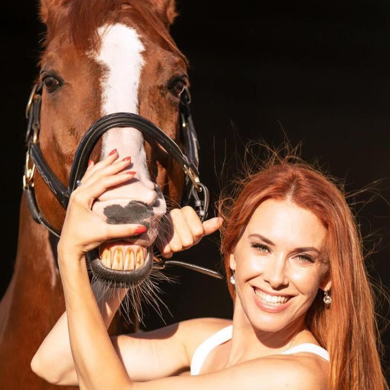Woman Posing With Smiling Horse