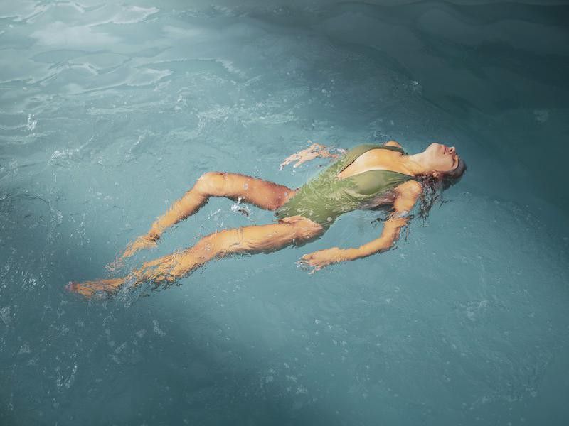 Woman swimming in the ocean
