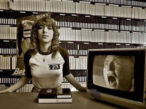 Women clerk at an early video store