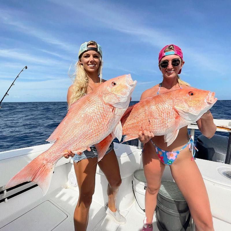 Women with red snappers