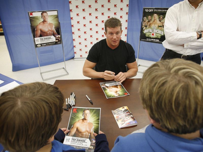 Wrestler for WWE Ted DiBiase talks with fans