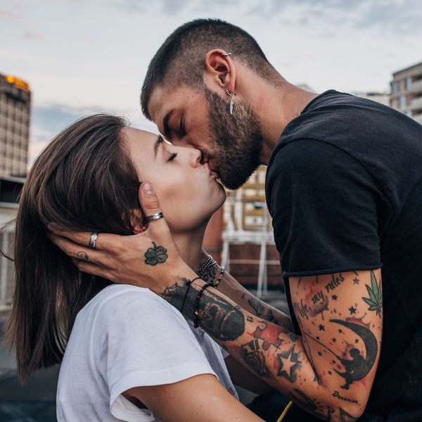 Young urban couple kissing passionately
