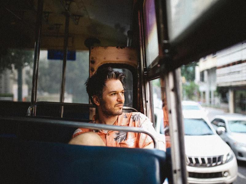 Young man riding on a bus