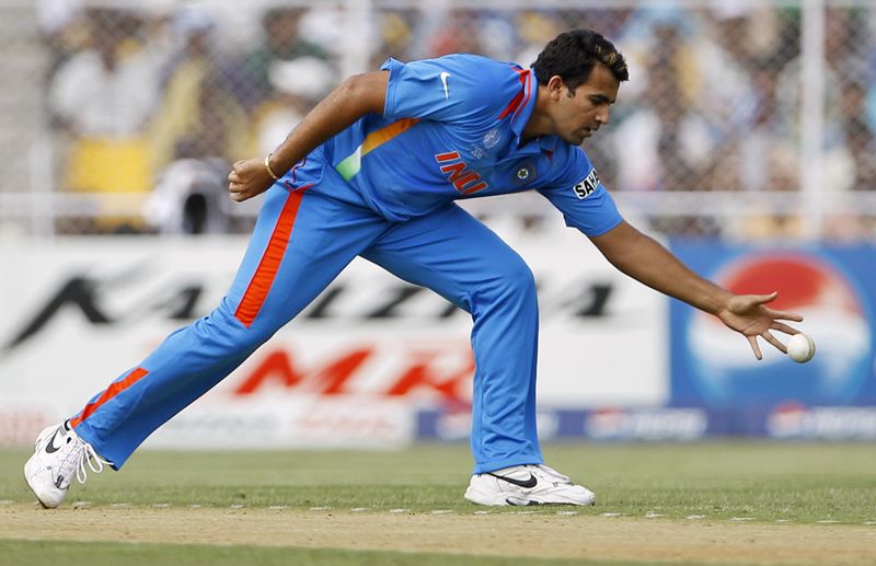 Zaheer Khan reaches to stop ball